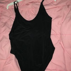 Nigh used simple sexy black bodysuit